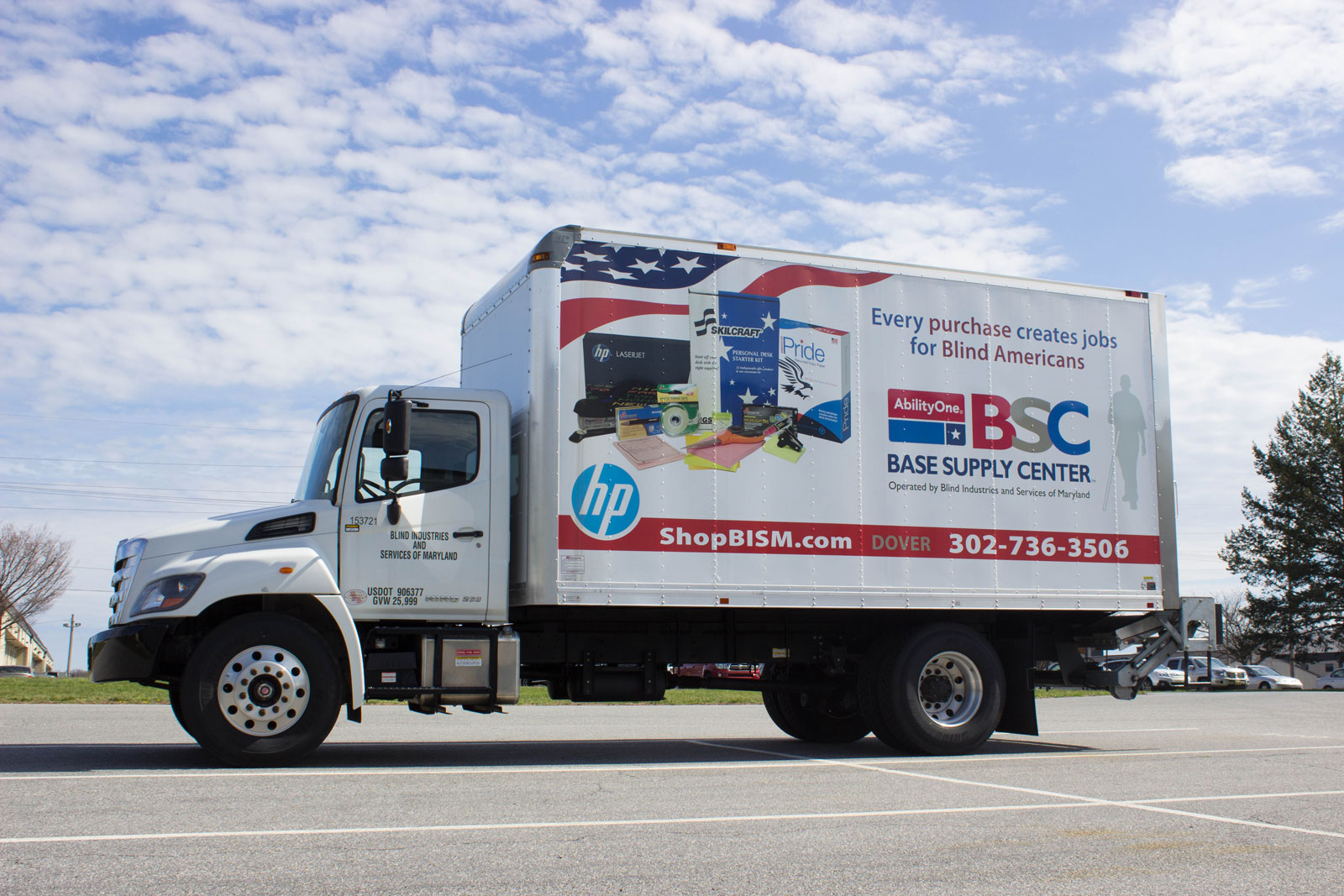 Box truck with BSC logo and product display on side